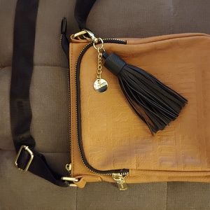 Steve Madden camel color purse with black accents